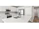 Modern kitchen features quartz countertops, stainless steel appliances and pantry at 572 Sw 77Th Cir, Ocala, FL 34480
