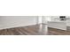 Open-concept living area features wood flooring and integrates with a modern kitchen at 572 Sw 77Th Cir, Ocala, FL 34480
