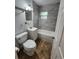 Modern bathroom with updated tiling, vanity, and a shower-tub combination at 3203 Decatur Ave, Lakeland, FL 33805