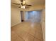 Spacious bedroom features tile floors, closet, and ceiling fan at 3203 Decatur Ave, Lakeland, FL 33805