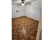 Bedroom with patterned floors, ceiling fan, and neutral wall color at 3203 Decatur Ave, Lakeland, FL 33805