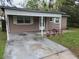 Charming single-story home with a covered front porch and a cozy, well-maintained yard at 3203 Decatur Ave, Lakeland, FL 33805