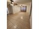 Open living area features tile floors, two ceiling fans, and neutral wall color at 3203 Decatur Ave, Lakeland, FL 33805