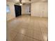 Bright living space with tile flooring, ceiling fan, and large windows for natural light at 3203 Decatur Ave, Lakeland, FL 33805