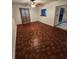 Inviting living room with stylish patterned flooring and a ceiling fan at 3203 Decatur Ave, Lakeland, FL 33805