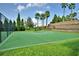 Outdoor basketball court surrounded by lush landscaping, ideal for recreation at 5126 Villa Crest Way, Auburndale, FL 33823