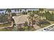 Aerial view of the community clubhouse showing manicured landscaping, tile roof, and well-maintained grounds at 5126 Villa Crest Way, Auburndale, FL 33823