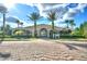 Inviting clubhouse with desert landscaping, covered entry, and ample parking for residents and guests at 5126 Villa Crest Way, Auburndale, FL 33823