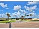 Beautiful community entrance with manicured landscaping and stately signage, promoting a luxurious feel at 5126 Villa Crest Way, Auburndale, FL 33823