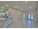 Bright living room with tile floors, recessed lighting, and an open layout to the kitchen at 5126 Villa Crest Way, Auburndale, FL 33823