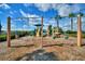 Community playground with swings, slide, and climbing structure, perfect for outdoor fun at 5126 Villa Crest Way, Auburndale, FL 33823
