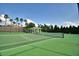 Well-maintained tennis court next to gazebo in a lushly landscaped community at 5126 Villa Crest Way, Auburndale, FL 33823