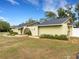 Ranch-style home with landscaped yard and driveway at 1336 Stratton Dr, Lakeland, FL 33813