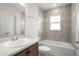 Bathroom with neutral tile and a tub and shower combination at 1365 Melrose St, Lake Alfred, FL 33850