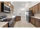 Well-equipped kitchen with stainless steel appliances and plenty of cabinets at 1365 Melrose St, Lake Alfred, FL 33850