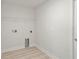 Utility room with tile flooring and space for washer and dryer at 1365 Melrose St, Lake Alfred, FL 33850