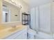Bright bathroom with a large mirror, white vanity, and combined tub and shower at 1836 N Crystal Lake Dr # 46, Lakeland, FL 33801