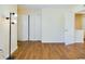 Bedroom featuring hard wood floors and closet with folding doors at 1836 N Crystal Lake Dr # 46, Lakeland, FL 33801