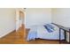 Bedroom with hardwood floors, and doorway to another room at 1836 N Crystal Lake Dr # 46, Lakeland, FL 33801