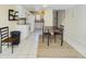 Bright dining area with tiled floor and views of the open kitchen at 1836 N Crystal Lake Dr # 46, Lakeland, FL 33801