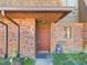 Charming brick home featuring a covered entryway and a decorative front door at 1836 N Crystal Lake Dr # 46, Lakeland, FL 33801