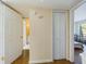 Hallway with closet, leading to bedroom and bathroom with an open doorway at 1836 N Crystal Lake Dr # 46, Lakeland, FL 33801