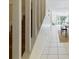 Bright hallway with tiled flooring leading to the living room with a sliding glass door at 1836 N Crystal Lake Dr # 46, Lakeland, FL 33801