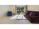 Bright living room with a large window, tiled flooring, and comfortable seating at 1836 N Crystal Lake Dr # 46, Lakeland, FL 33801
