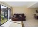 Cozy living room featuring large sliding glass doors and tiled flooring at 1836 N Crystal Lake Dr # 46, Lakeland, FL 33801