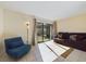 Spacious living room featuring tiled floors and a sliding door to the outside at 1836 N Crystal Lake Dr # 46, Lakeland, FL 33801