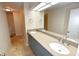 Modern bathroom features double sinks, updated fixtures, and a large mirror at 2556 Roslyn Ln, Lakeland, FL 33812
