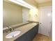 Bathroom with double sink vanity and large mirror at 2556 Roslyn Ln, Lakeland, FL 33812