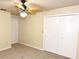 Bedroom featuring neutral carpet and closet at 2556 Roslyn Ln, Lakeland, FL 33812