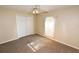 Cozy bedroom featuring a ceiling fan, neutral carpet, and a window with blinds at 2556 Roslyn Ln, Lakeland, FL 33812