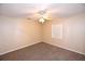 Inviting bedroom boasting a ceiling fan and carpeted floors at 2556 Roslyn Ln, Lakeland, FL 33812