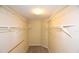 A walk in closet with installed shelving for optimal storage and organization at 2556 Roslyn Ln, Lakeland, FL 33812