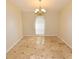 Dining area showcases tile flooring, decorative light fixture, and a bright window at 2556 Roslyn Ln, Lakeland, FL 33812