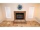 Close-up of a mosaic fireplace with decorative clock, flanked by windows with white vertical blinds at 2556 Roslyn Ln, Lakeland, FL 33812