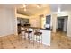 Open concept kitchen with breakfast bar, stainless steel appliances, and easy access to dining area at 2556 Roslyn Ln, Lakeland, FL 33812