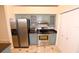 Kitchen featuring stainless steel appliances and custom cabinetry at 2556 Roslyn Ln, Lakeland, FL 33812