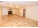 Spacious living room with neutral walls, tile flooring, and a charming mosaic fireplace feature at 2556 Roslyn Ln, Lakeland, FL 33812