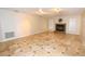 Living room featuring tile floors, mosaic fireplace, bright lighting, and neutral decor at 2556 Roslyn Ln, Lakeland, FL 33812