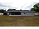 Exterior view shows the screened-in patio and yard at 2556 Roslyn Ln, Lakeland, FL 33812