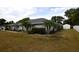 Lush lawn surrounds this house, complete with a convenient storage shed at 2556 Roslyn Ln, Lakeland, FL 33812