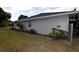 Exterior view shows well-maintained landscaping around the perimeter at 2556 Roslyn Ln, Lakeland, FL 33812