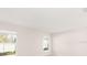 Bright bedroom with big windows and neutral walls at 3166 Laurel Oak Ln, Winter Haven, FL 33884