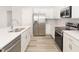 Bright kitchen with stainless steel appliances, white cabinets, and a spacious countertop at 3166 Laurel Oak Ln, Winter Haven, FL 33884