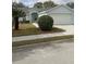 One-story house with attached garage and landscaping at 4197 Cannes Ave, Lake Wales, FL 33859