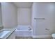 Bright bathroom featuring a soaking tub, granite countertop, and wood-look tile flooring at 4712 Grandview Glen Dr, Auburndale, FL 33823