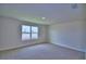 Unfurnished bedroom featuring a neutral color scheme and a bright window at 4712 Grandview Glen Dr, Auburndale, FL 33823